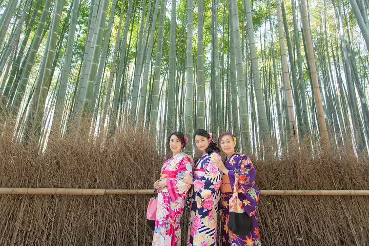 Three women in colorful kimono at Arashiyama Bamboo Grove, Kyoto private vacation photographer group photo shoot