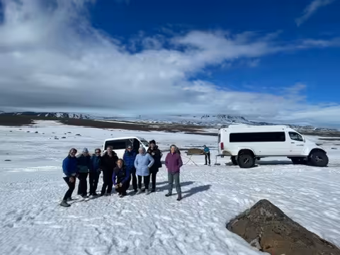 Group of women enjoying a snowy adventure in the Icelandic Highlands during a winter wellness retreat.