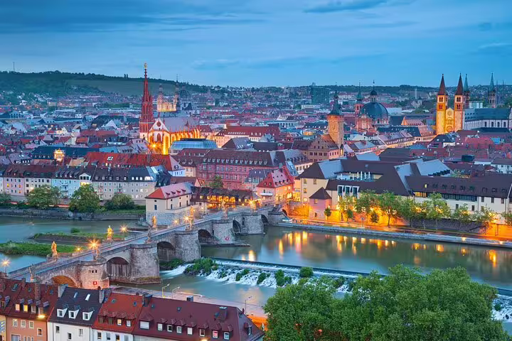 Würzburg skyline over the Main River and Old Main Bridge at dusk, featured on self-guided scavenger hunt tour
