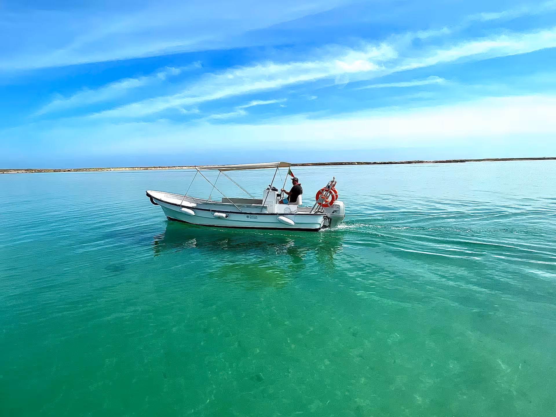 Yamaha speed boat rental cruising on calm turquoise lagoon waters, ideal for Algarve private boat tour