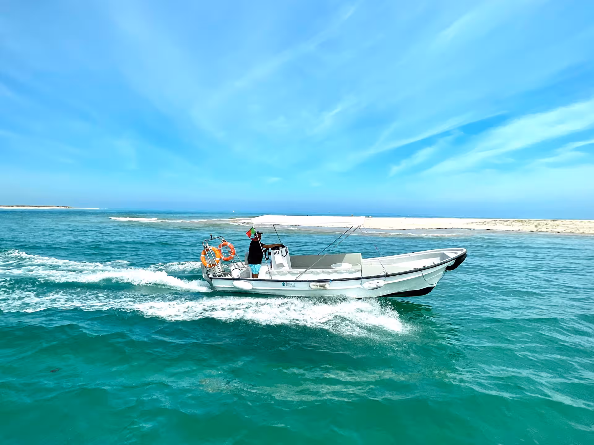 Rent-a-Boat Yamaha speed boat speeding across turquoise sea near sandbar, perfect Algarve self-drive trip