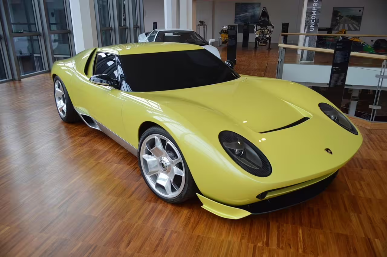 Discover the futuristic design of a yellow Lamborghini concept car at Bologna's Lamborghini Museum tour.