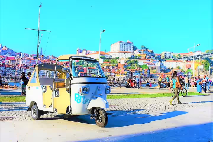 Yellow and white tuk tuk parked on a sunny day near the historic center, perfect for a private cruise shore excursion tour.