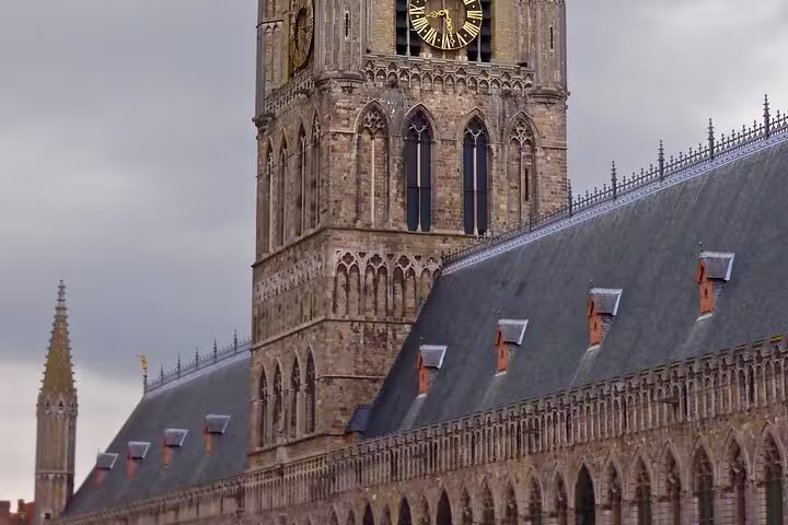 Close-up of Ypres Cloth Hall clock tower, landmark stop on the self-guided e-scavenger hunt walking tour