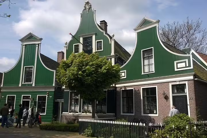 Traditional green Zaanse Schans houses in the Netherlands on a private Volendam and Zaanse Schans tour from Amsterdam