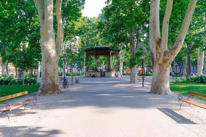 Zagreb park promenade with historic pavilion, leafy trees and benches on a 7-day Croatia private tour