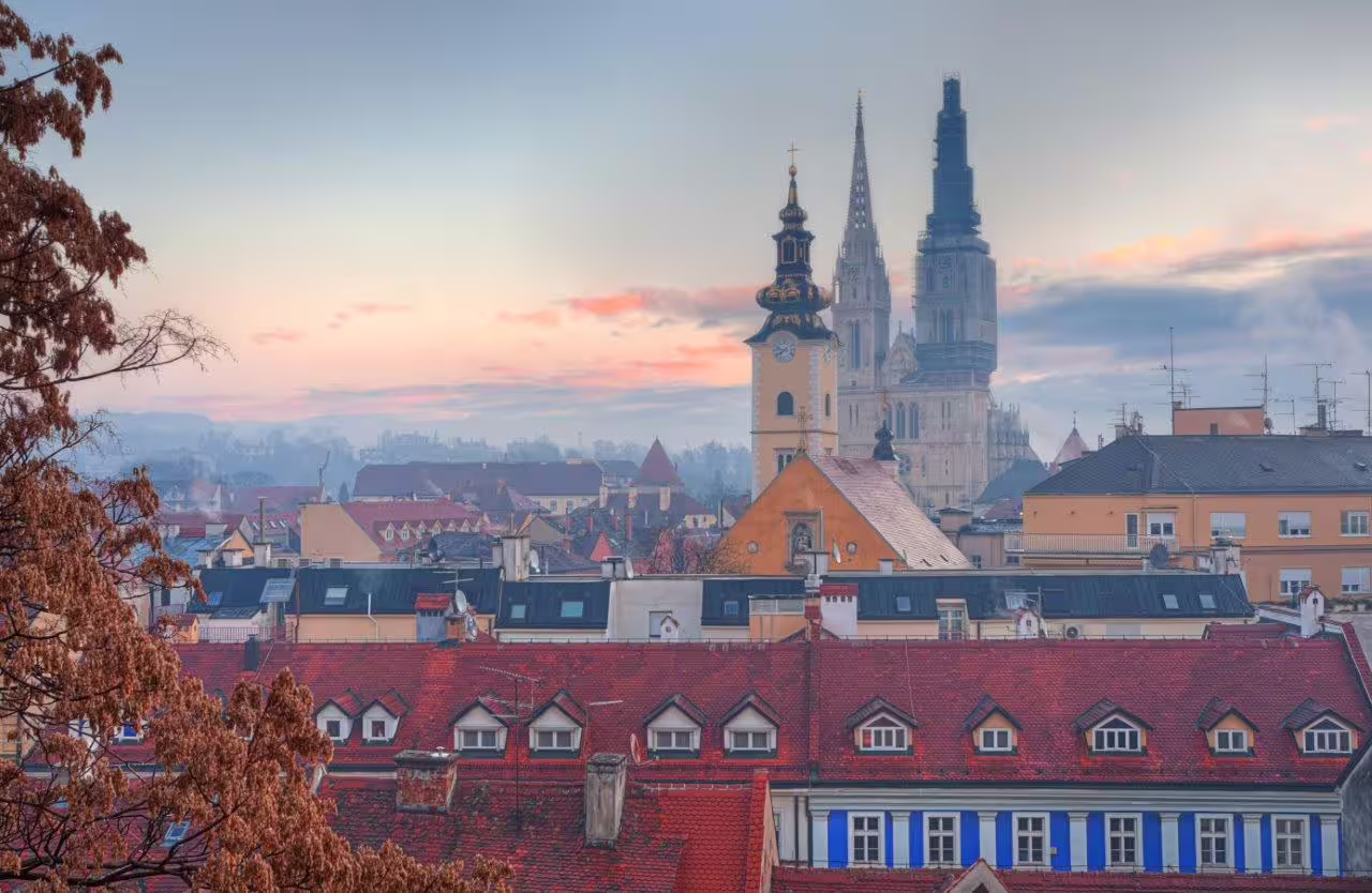 Sunset view of Zagreb rooftops with Cathedral spires, perfect highlight on Escape to Zagreb 3 Days private tour