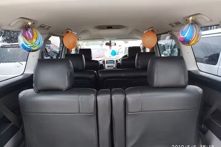 Comfortable interior of a private transfer vehicle for Zanzibar Airport hotel service.