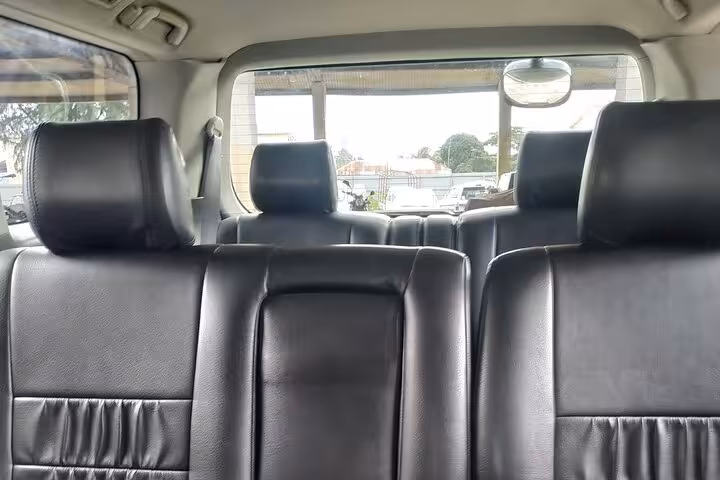 Spacious and comfortable interior of a shuttle vehicle used for Zanzibar airport transfers.