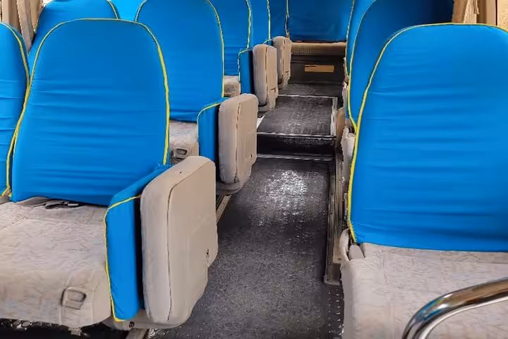 Comfortable interior with blue seats for private airport transfer service in Zanzibar, ensuring a relaxed journey.