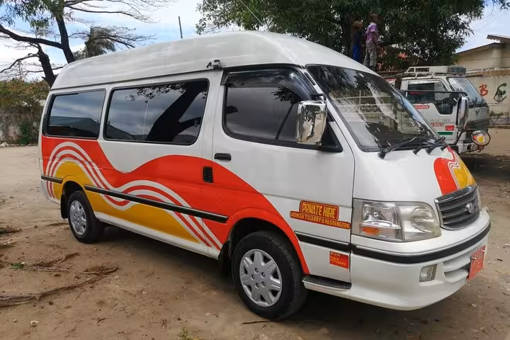 Decorative private transfer van in Zanzibar for convenient round trip airport services.