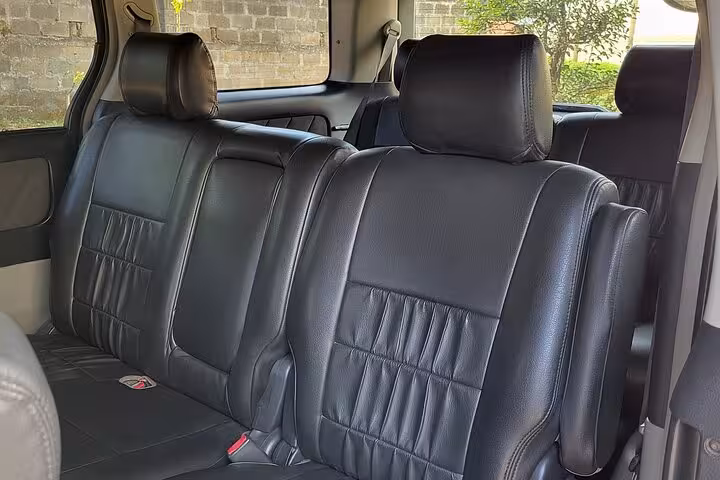 Spacious black leather interior of a private transfer vehicle for Zanzibar airport to East Coast hotels.
