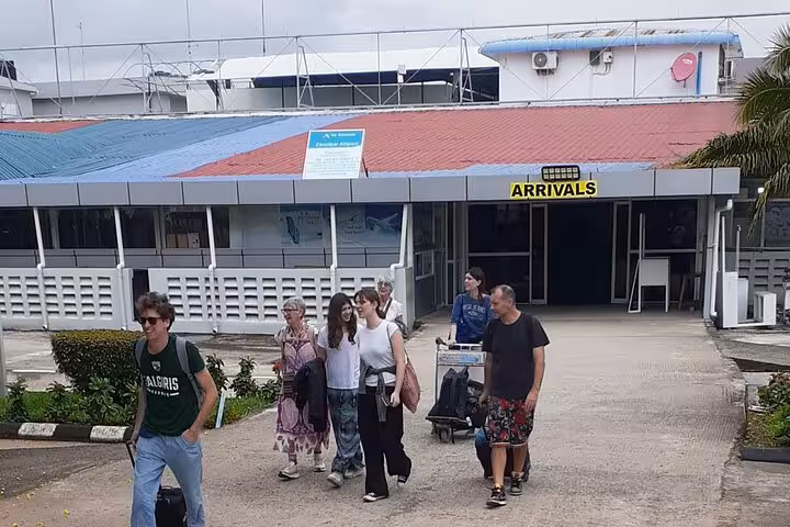 Travelers arriving at Zanzibar airport ready for convenient island transfers and shuttle services.