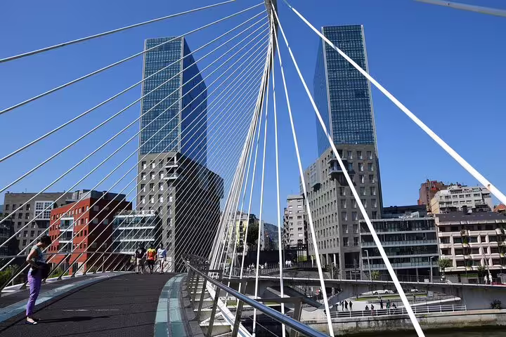 Zubizuri footbridge and Bilbao skyline on a self-guided e-scavenger hunt walking tour route
