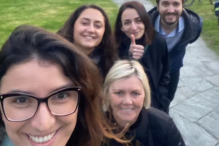 Group selfie on a Zug park path enjoying a self-guided scavenger hunt and sights tour in Switzerland