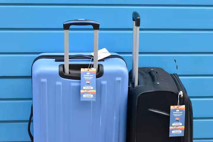Suitcases with Stasher tags ready for Zurich Airport luggage storage, secure short-term bag drop service