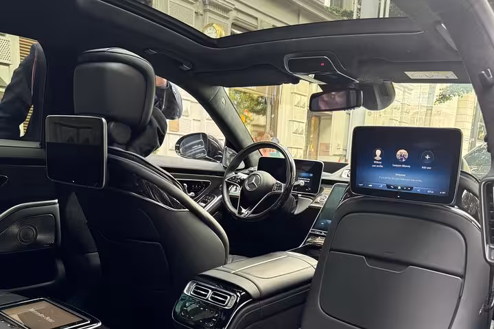 Luxury Mercedes sedan interior for Zurich Airport transfer service with spacious leather seats and infotainment