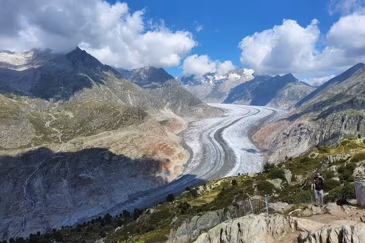 Panoramic view of the Great Aletsch Glacier winding through Swiss Alps, highlight of a Zurich day trip