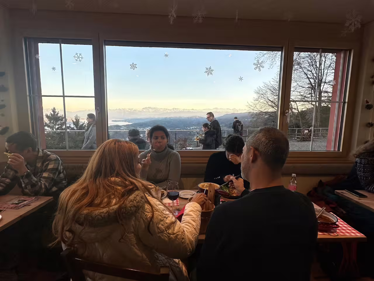 Indoor dining with panoramic Alpine views, Zurich cable car tour experience.