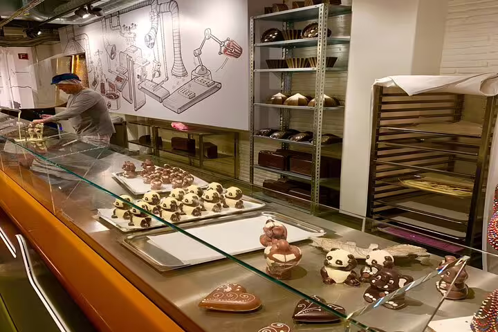 Indulge in exquisite chocolate creations during the Zurich Small Group Tour at a renowned chocolatier.
