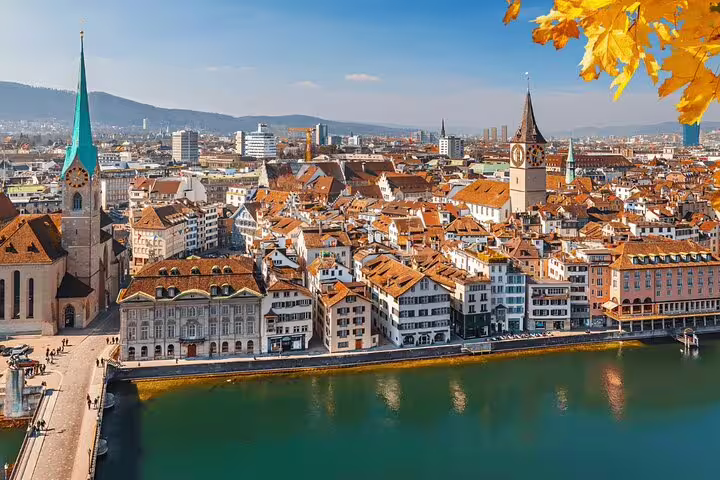 Panoramic view of Zurich's historic old town, showcasing iconic architecture and the Limmat River.