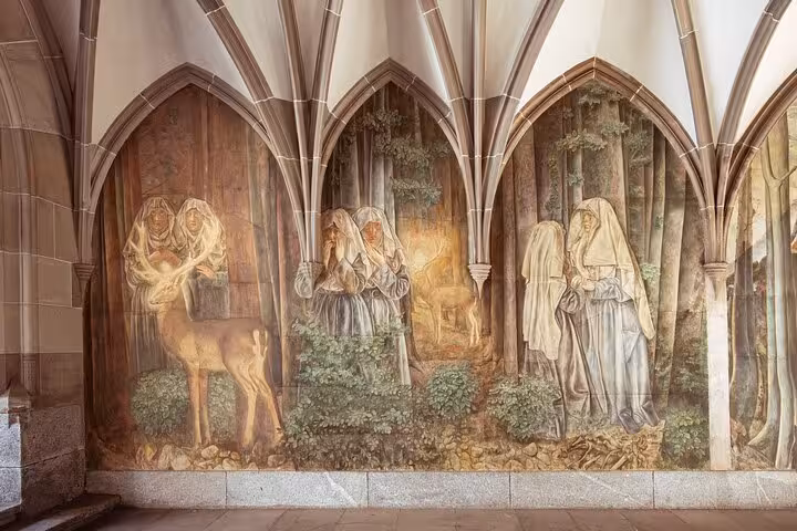 Medieval fresco under Gothic arches in Zurich Old Town, a hidden spot on the Zurich 360 city walk tour