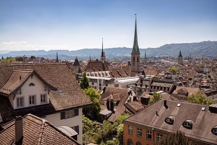 Panoramic Zurich Old Town rooftops and church spires, scenic viewpoint stop on the Zurich 360 City Walk Tour