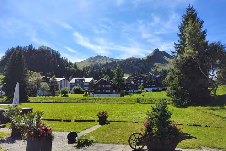 Alpine village and green meadows near Mount Rigi, scenic stop on a Zurich day trip in central Switzerland