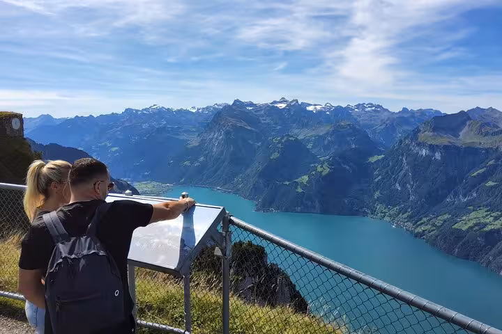 Couple at Rigi viewpoint overlooking Lake Lucerne on Zurich day trip with steepest funicular ride