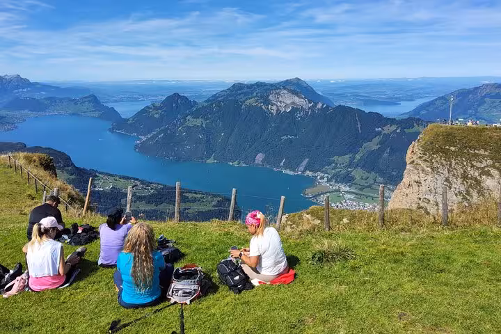 Picnic break on Mount Rigi overlooking Lake Lucerne, a highlight of the Zurich day trip and steep funicular tour