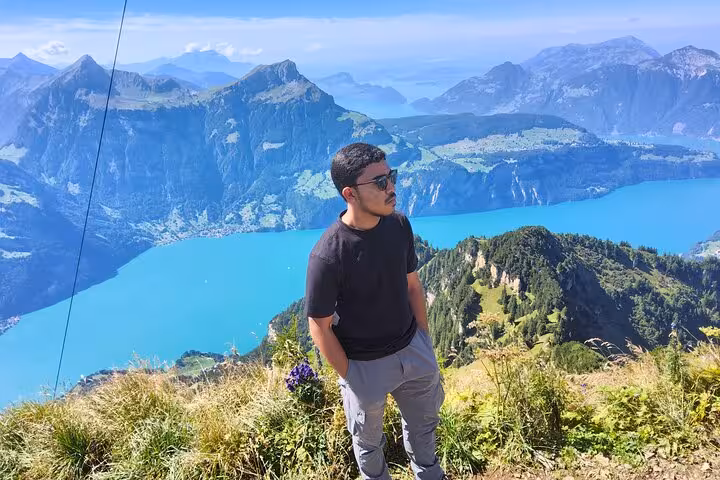 Traveler at Rophaien panoramic peak overlooking Lake Lucerne on a Zurich day trip in the Swiss Alps