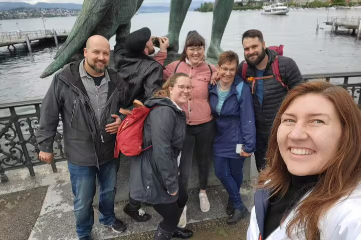 Group photo at Lake Zurich statue stop during a Zurich scavenger hunt and sights self-guided walking tour