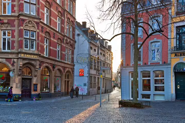 Historic cobblestone street in Aachen old town, route scene from a self-guided scavenger hunt highlights tour