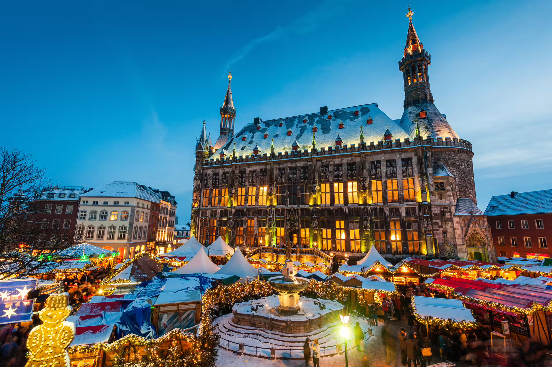 Aachen Town Hall and festive Christmas market at dusk, highlight stop on Aachen 1-day walking audioguide