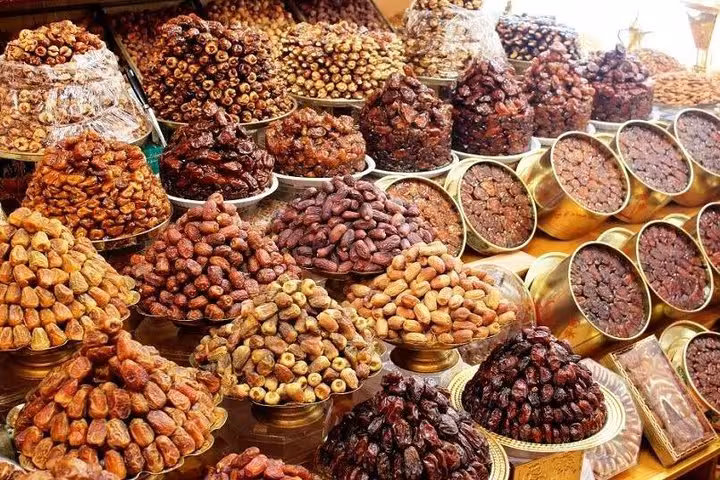 Explore Abu Dhabi's vibrant markets with an array of fresh dates, showcasing Middle Eastern culinary delights.