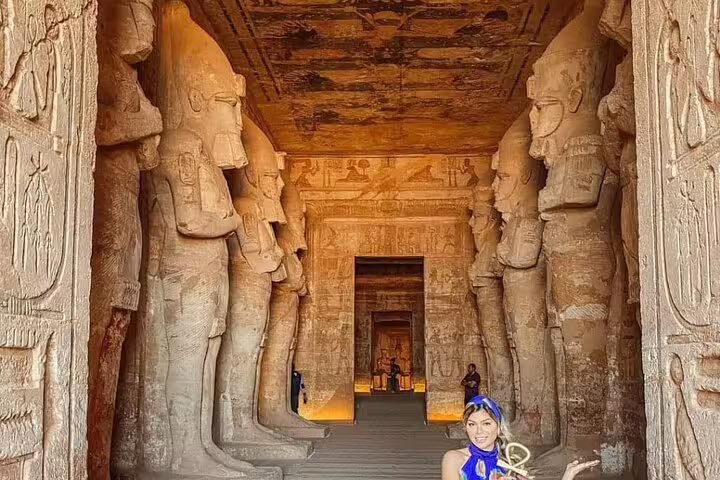 Great Temple of Abu Simbel interior hall with towering Osiris statues on day tour from Aswan, Egypt