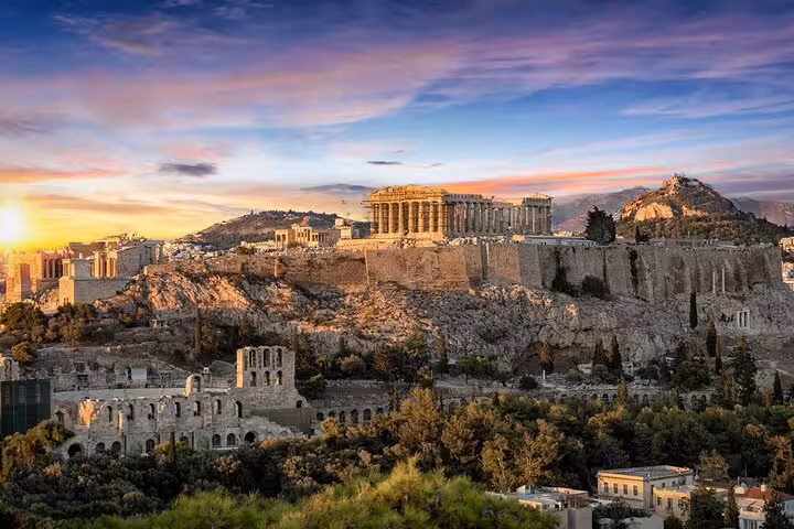 Acropolis and Parthenon glowing at dusk over Athens skyline, highlight of Athens by Night walking tour