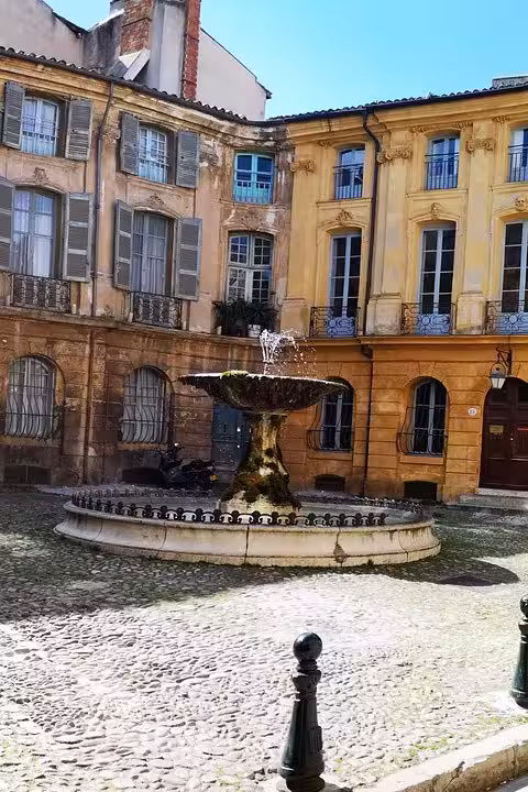 Aix-en-Provence old town square fountain and historic facades on a private shore excursion from Arles