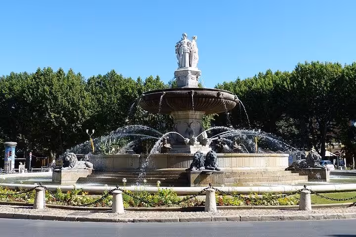 Aix-en-Provence Rotonde fountain on sunny day, key stop on Cézanne and the winegrowers wine tour