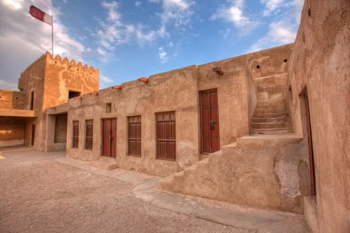 Discover the historic architecture of Al Zubarah Fort under the vibrant Qatar sky.