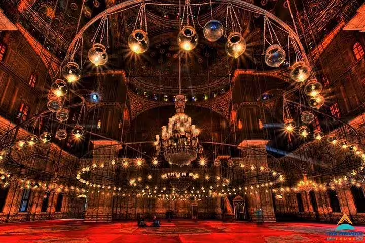 Alabaster Mosque interior in Cairo with grand chandelier and ornate lights, part of 2-day Cairo by air tour from Hurghada