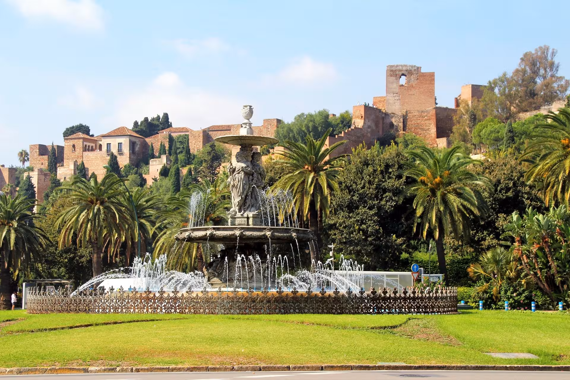 Scenic view of the Alcazaba fortress with a fountain in the foreground, ideal for a guided tour in Malaga.