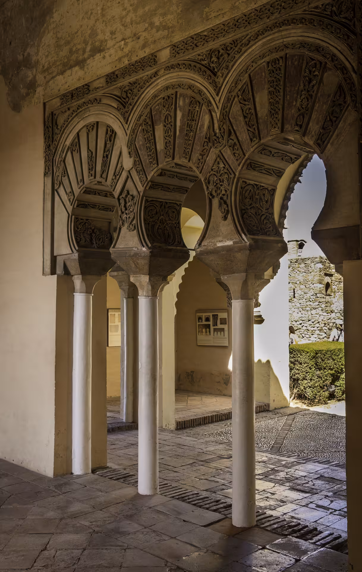 Intricate Moorish arches inside the Alcazaba of Malaga, highlighting the site's rich architectural heritage.