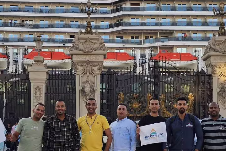 Tour staff meet cruise guests at Alexandria port gate for Giza Pyramids tour with Nile cruise and Egyptian lunch
