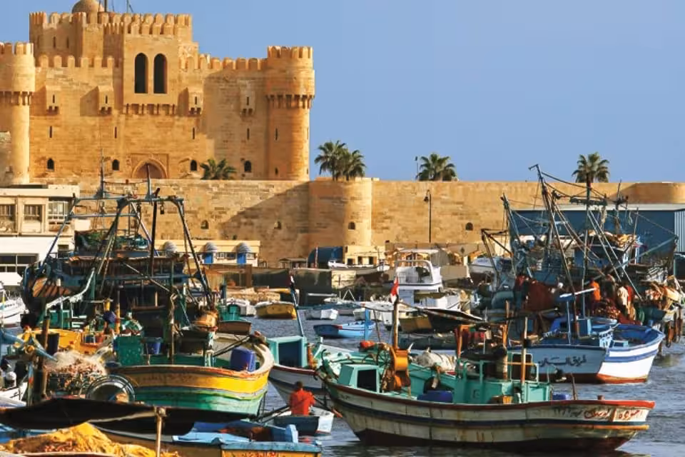 Alexandria’s Qaitbay Citadel and colorful fishing boats on the Mediterranean, Cleopatra’s Egypt tour stop