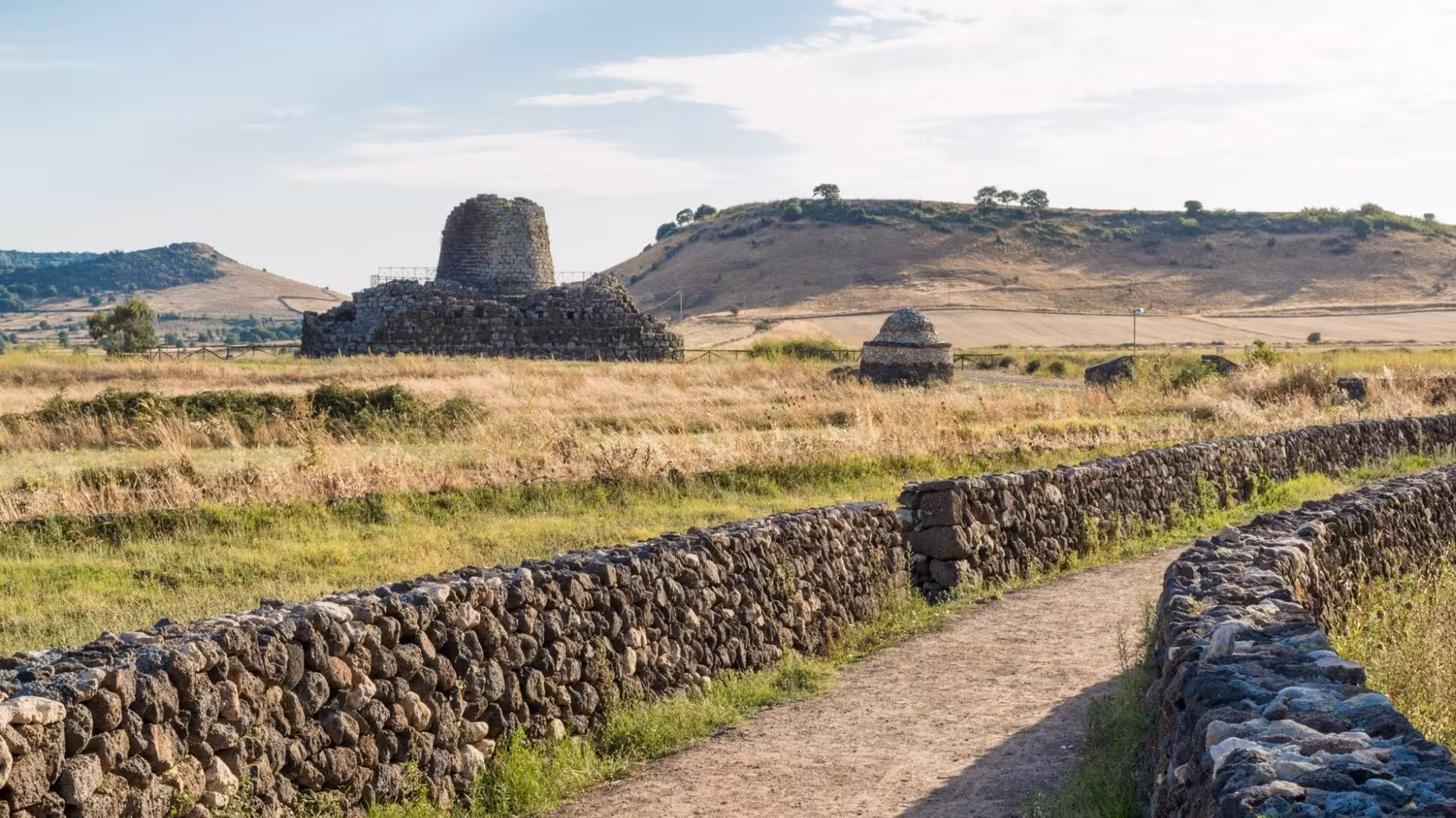 Explore ancient stone structures in Alghero's archaeological tour with panoramic views and rich history.