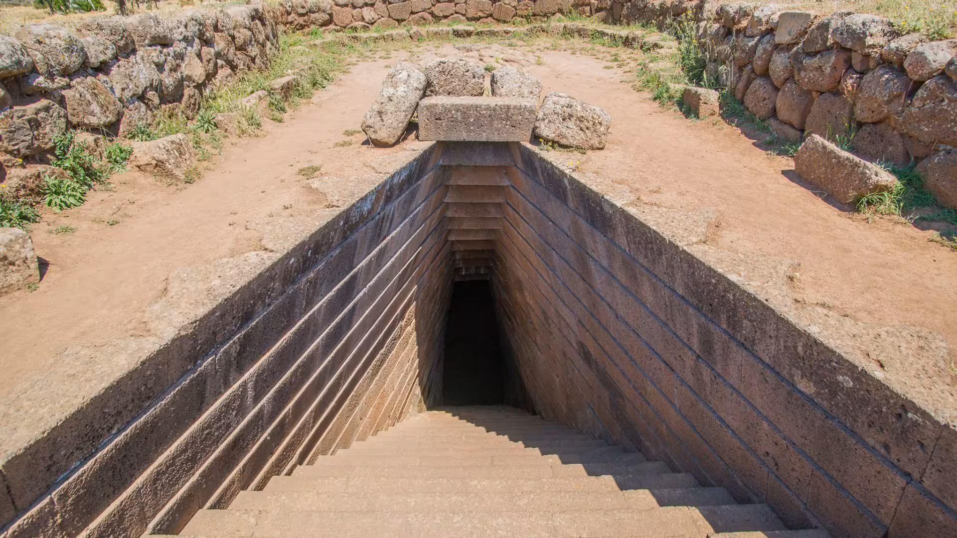 Discover the mystical stone stairs leading underground on Alghero's archaeological tour, a must-see historic site.