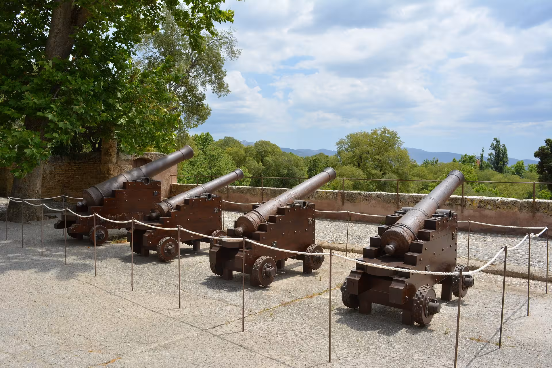 Historic cannons displayed on the grounds of the Alhambra, offering a glimpse into Granada's rich past.