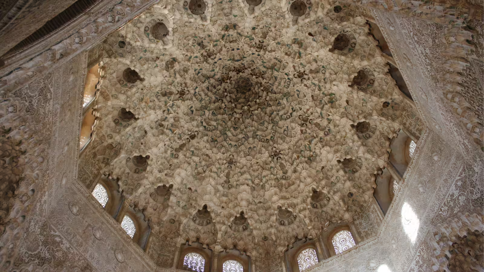 Intricate Nasrid Palace muqarnas dome ceiling at the Alhambra, seen on a private tour from Costa del Sol