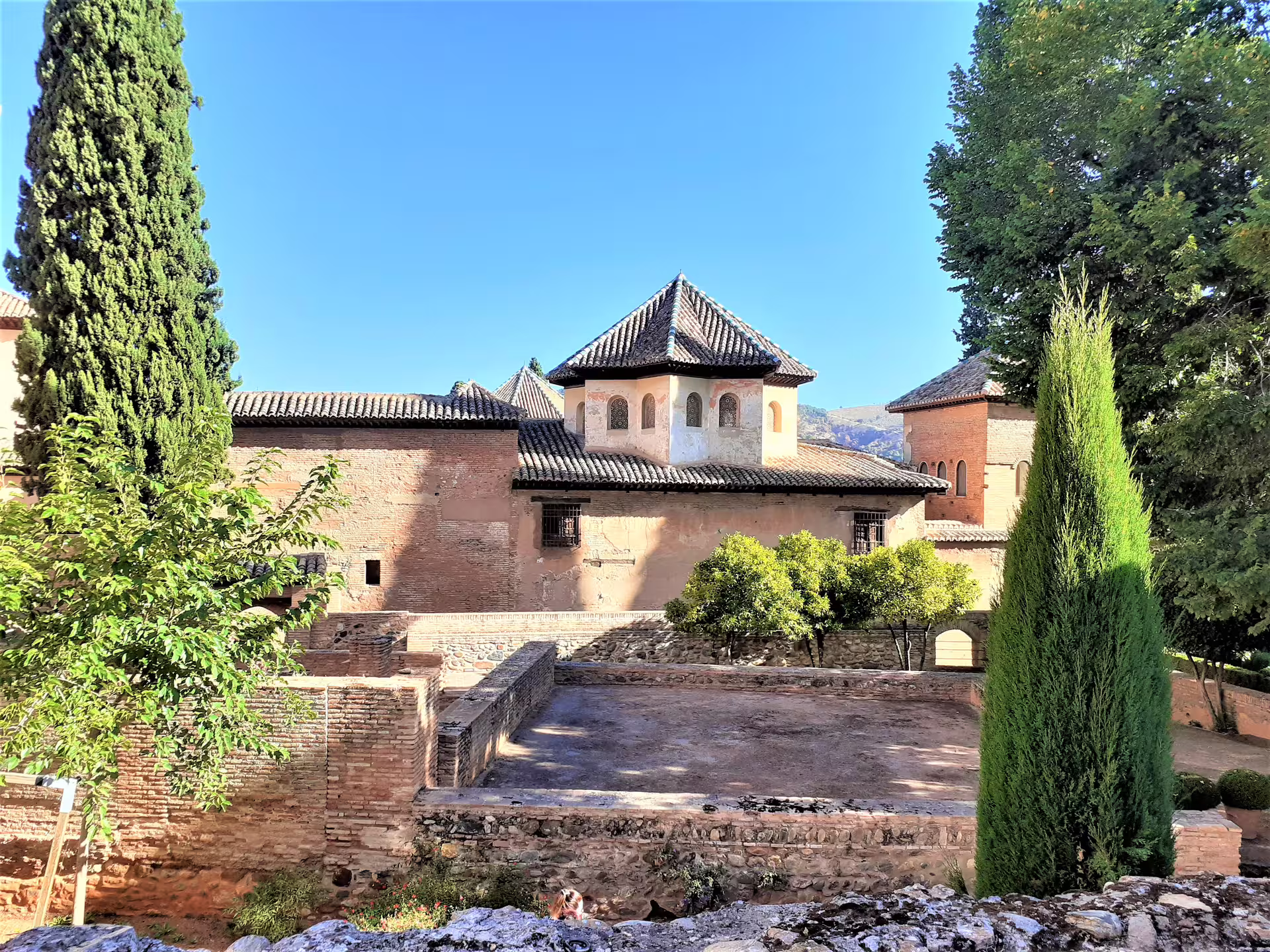 Historic Alhambra palace gardens and Moorish architecture in Granada seen on a private guided walking tour
